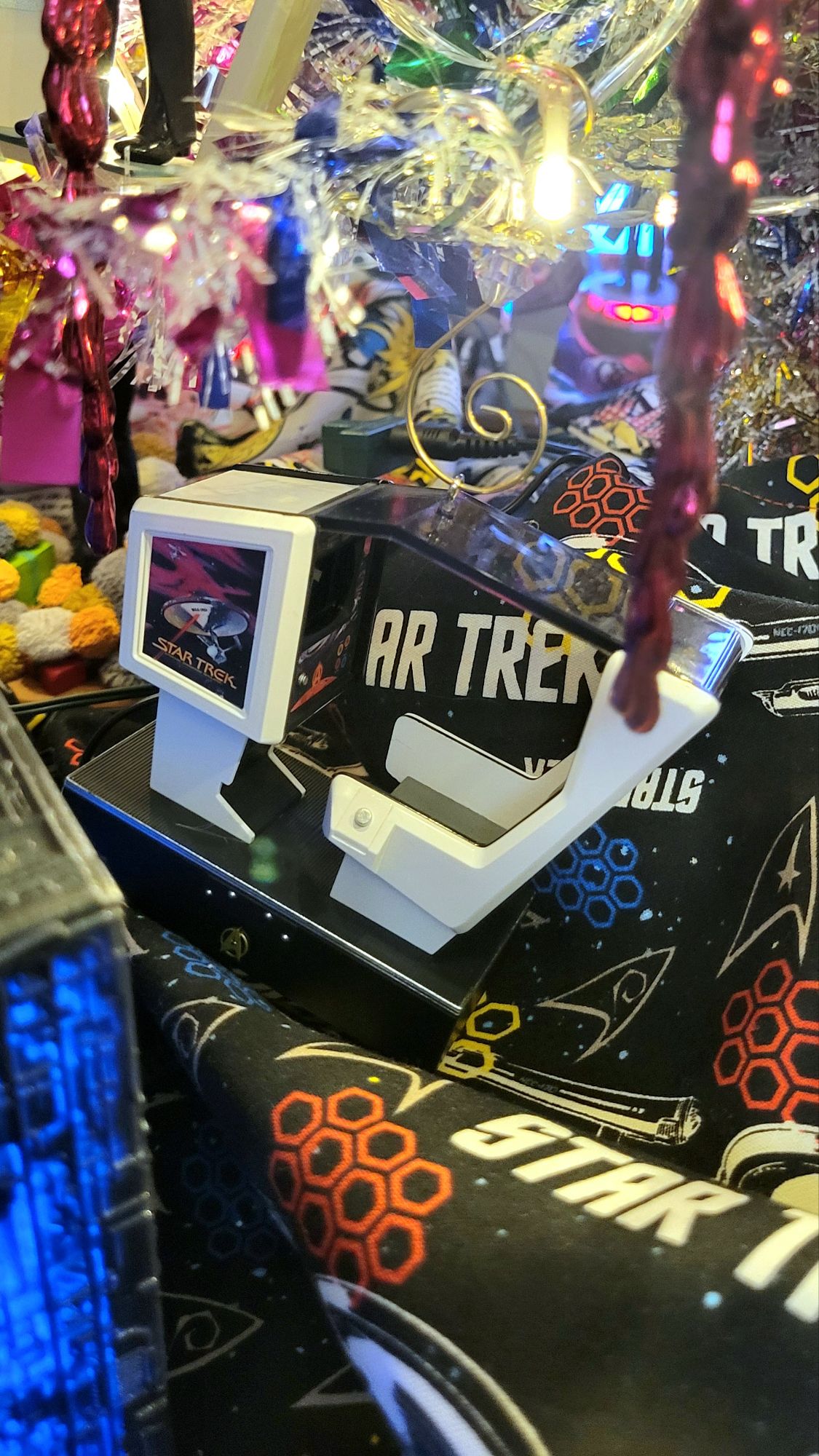 close-up of the new Star Trek arcade game ornament. the screen lights up and dialog from the game plays.