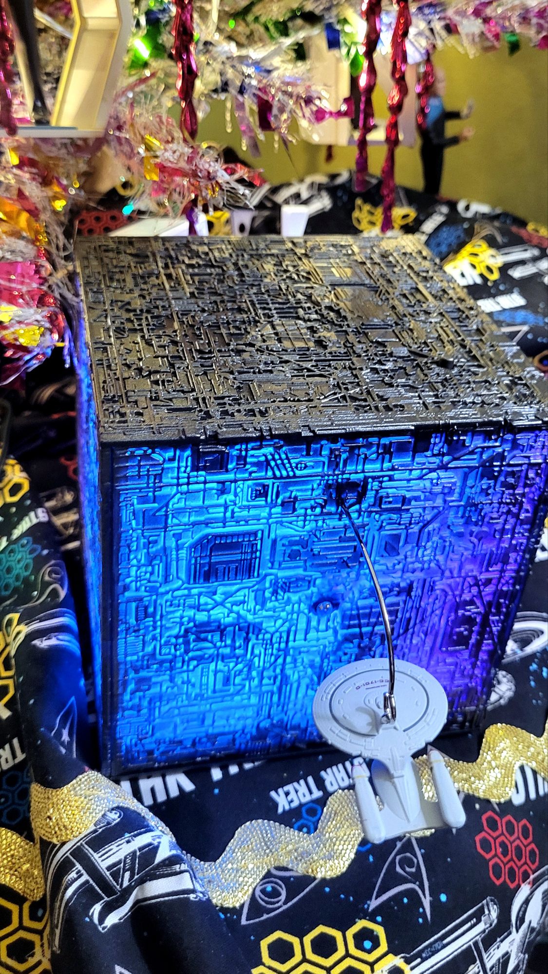 close-up of the Borg Cube tabletop decoration, complete with mini Enterprise D.